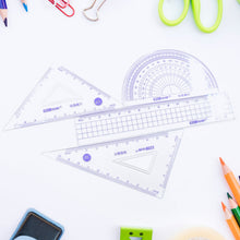Ruler set including various drafting tools for students and office use.